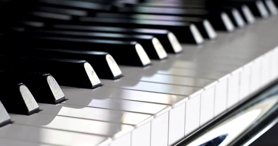 Close-up of black and white piano keys for music and instrument imagery.
