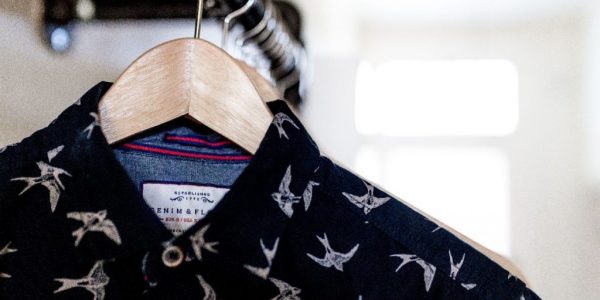 Clothing on a hanger in a retail store for fast fashion analysis.