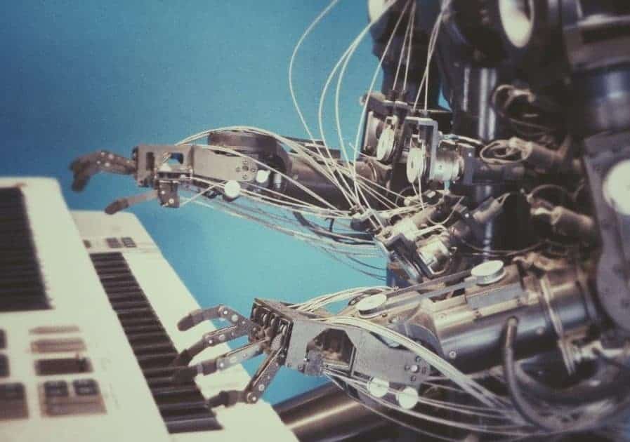 Robotic arm interacting with a keyboard, showcasing AI and automation technology.